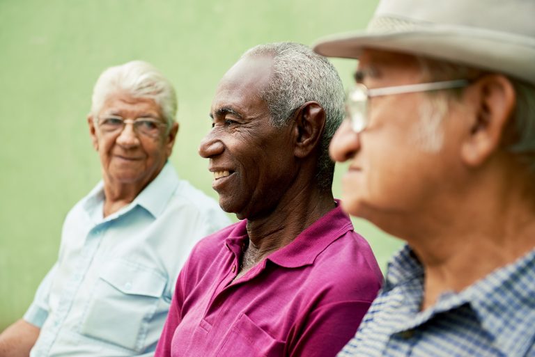 group-of-old-black-and-caucasian-men-talking-in-PBGX6ZZ-768x513