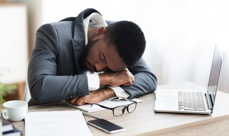 tired-african-american-businessman-having-a-nap-GW7VYPC-768x457
